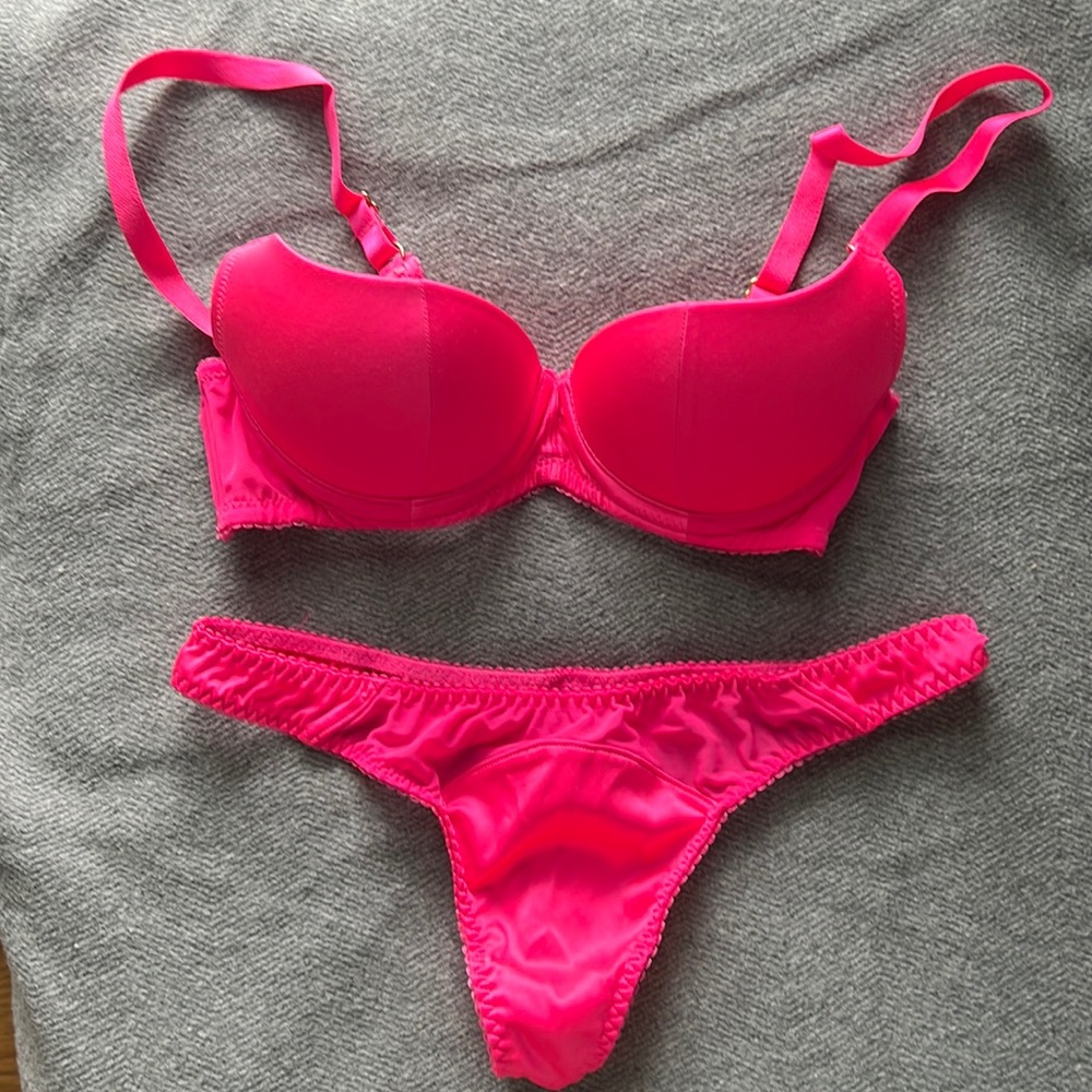 Agent Provocateur half cup push up bra and matching thong in hot pink.